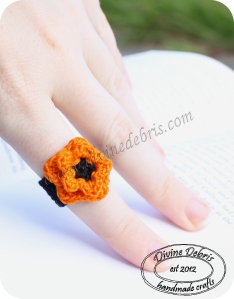 Black and orange flower ring by Divine Debris
